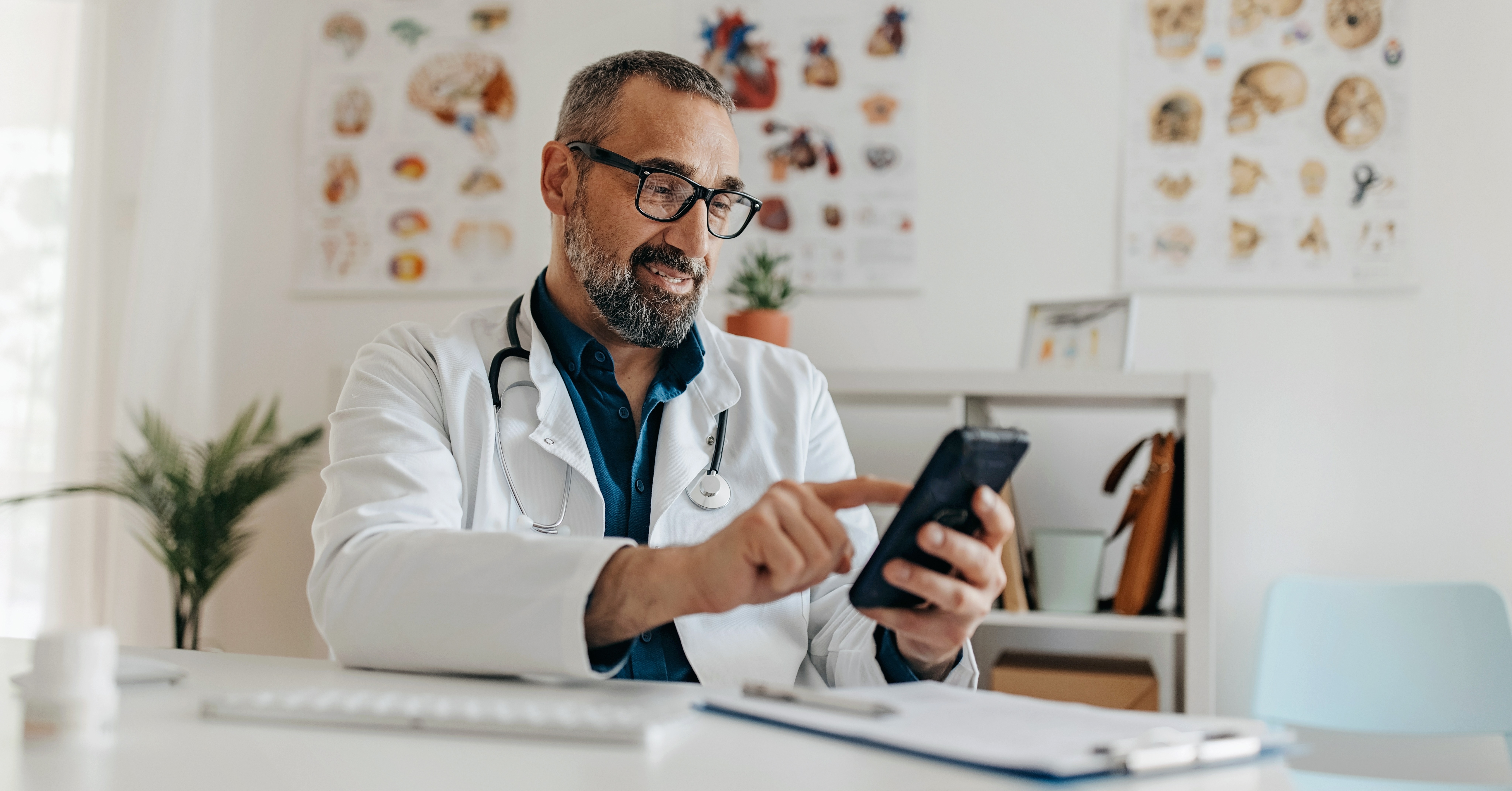 Physician uses his smartphone